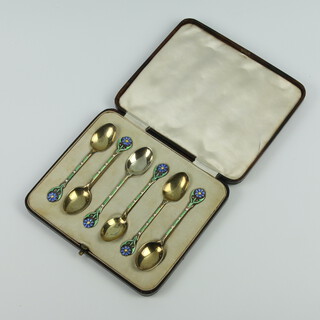 A set of silver and enamel coffee spoons with floral decoration Birmingham 1936, 46 grams, 9cm, cased 