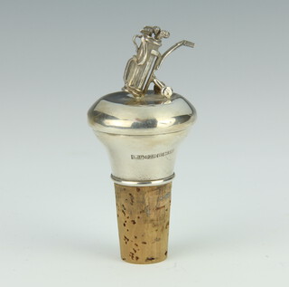 A silver mounted bottle stopper with a bag of golf clubs finial 8cm 