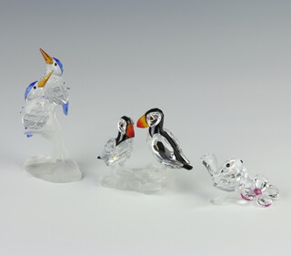 A Swarovski Crystal kingfisher group 9cm, a pair of puffins 6cm and a chick 3cm, boxed 