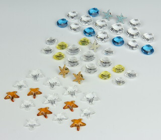 A Swarovski Crystal collection of orange and clear glass starfish, yellow and clear glass shells and blue and clear glass clams, all boxed 