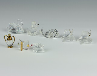 A Swarovski Crystal figure of a swan 4cm, ditto clam shell and 6 other crystal figures