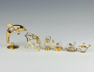 A Swarovski Crystal gilt metal mounted figure of a rocking horse 3cm, watering can 3cm and 4 other mounted crystal items 