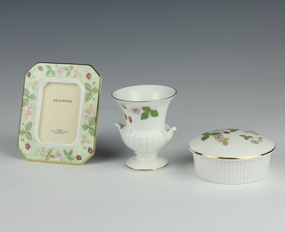 A Wedgwood Wild Strawberries box and cover 10cm, a ditto photograph frame 12cm and a vase 9cm  
