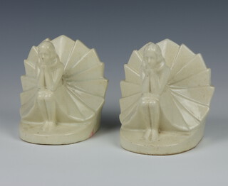 A pair of Art Deco ceramic bookends in the form of seated ladies 13cm 
