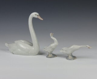 A Lladro figure of a goose 7cm (chipped beak), a ditto 11cm and a swan 20cm 