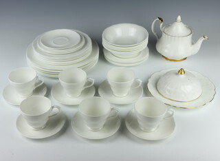 A Royal Albert Val D'or teapot, 6 white glazed teacups, 7 saucers, 2 small plates, 6 medium plates, 6 dinner plates together with a dish and cover 6 dessert bowls and 4 side plates 