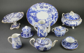 A matched Royal Crown Derby Mikado pattern tea, coffee and dinner service comprising 4 egg cups, preserve pot and lid (cracked), 2 condiments, a sauce boat (cracked), 2 tureens and covers (1 cover cracked), a cake stand, a centrepiece, four 2 handled cups, 4 saucers, 5 tea cups, 12 saucers, 9 coffee cups (4 cracked), 12 dessert bowls, a cream jug, a milk jug, a small sauce boat, a baluster jug (cracked), a tall jug, 14 tea plates, 8 small plates (2 cracked), 14 medium plates, 12 dinner plates, an oval meat plate, 3 sugar bowls and covers, 2 small rectangular dishes, 3 scalloped dishes (1 chipped), a coffee pot (cracked and no lid), a breakfast teapot and lid, a small bowl, a small dish, 1 odd lid, a small scalloped dish, a sandwich plate, 2 serving plates, a butter knife, cheese knife, bottle opener, fork, 6 butter knives and 6 knives and forks, all cased 