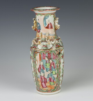 A 19th Century famille rose oviform rose decorated with panels of figures having lion handles 26cm 