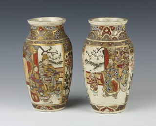 A pair of early 20th Century Satsuma vases decorated with panels of figures on pavilion terraces 24cm 
