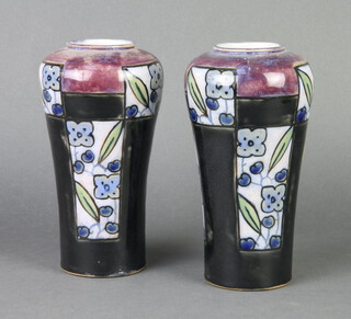 A pair of Royal Doulton waisted black glazed vase with floral decoration, base incised NB Royal Doulton and impressed 7943 20cm h x 7cm diam. 