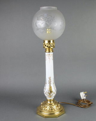 A gilt metal table lamp with opaque glass shade raised on an octagonal base 47cm x 19cm  