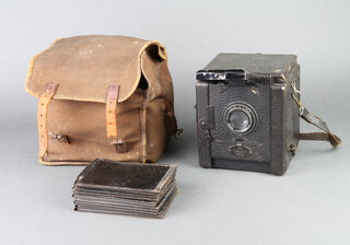 A The Salex Reflex camera together with 11 metal plate carriers contained in a fabric case