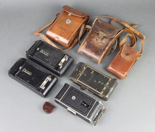 A Voigtlander folding camera, a Kodak vest pocket folding camera in leather case, a Kodak no.120 folding camera, 3 folding Kodak cameras and 1 other 
