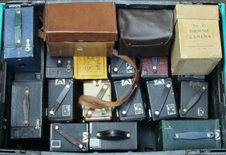 An Ensign box camera 2 1/4B, a No.2 Kodak Hawkeye model C box camera, a No.2 Hawkeye Model B ditto (partially boxed), a No.2 A Brownie ditto, two 6-20 Brownie C box cameras, a ditto D, ditto E, ditto F, three 6-20 Brownie Junior box cameras, a portrait Brownie No.2, a No.2 Brownie ditto boxed, ditto in leather case, Brownie Hawkeye No.2 model C and a No.2A Brownie model C   