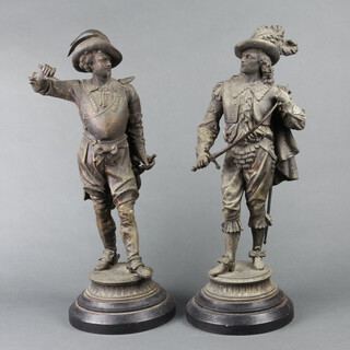 A pair of Victorian spelter figures of standing cavaliers, raised on socle bases 52cm h x 16cm w 