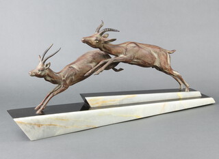 An Art Deco spelter and 2 colour marble figure group of 2 leaping gazelles raised on a shaped marble base 29cm h x 66cm w x 9cm d 