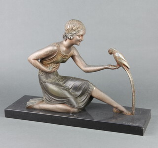 After D H Chiparus, an Art Deco spelter figure of a seated lady with parrot - "Feeding", raised on a rectangular marble base 33cm h x 
