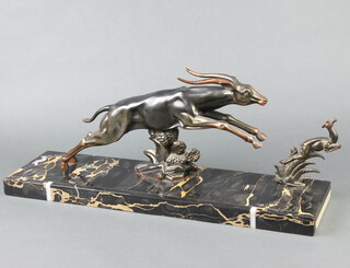 After Limousu, an Art Deco spelter figure group of a leaping gazelle and faun, raised on a veined marble base 26cm h x 60cm w x 16cm d  