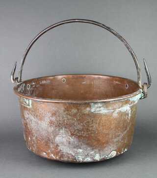 A large copper pot with polished steel handle 23cm h x 51cm diam. 