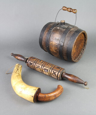 A coopered oak barrel 18cm h x 22cm diam. a powder horn 20cm x 6cm and a "gingerbread" wooden rolling pin 46cm x 5cm 