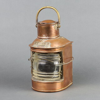 A copper and brass ships stern lamp, the reverse marked DL, 25cm h x 10cm w x 11cm d 