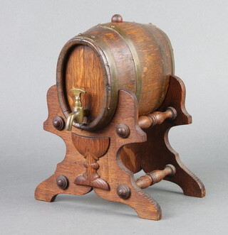 A Continental coopered oak spirit barrel, raised on a turned oak stand 21cm h x 16cm x 18cm 