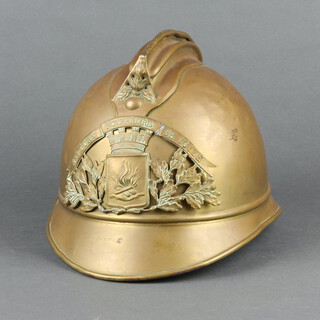 A Belgian Adrion patent fireman's brass helmet (some dents)