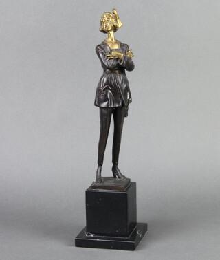 An Art Deco style bronze figure of a standing lady smoking a cigarette raised on a black veined marble base 38cm h x 10cm x 10cm 