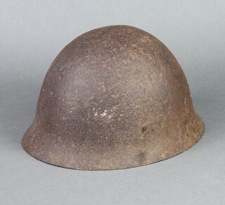 A steel helmet (some corrosion and holes) 20cm x 28cm x 24cm (no liner) 