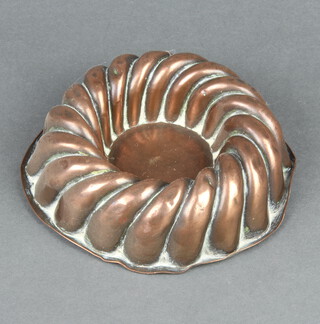 A circular copper jelly or ice cream mould 4cm x 15cm 