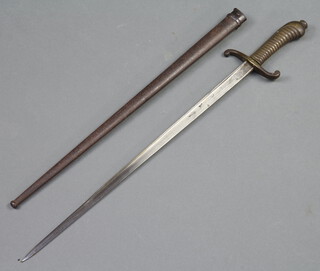 A 19th Century French Faschinenmesser style sword, the blade marked St Etienne 1879 complete with scabbard, also marked 107 R 10 461 
