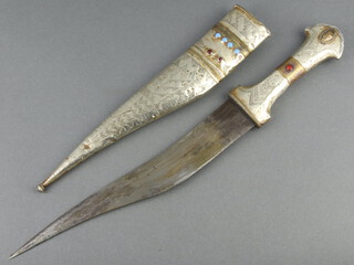 An Eastern dagger with 24cm blade contained in a white metal scabbard set hardstones 