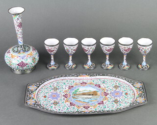 An Iranian enamelled club shaped vase 19cm x 7cm, ditto twin handled tray decorated a building 33cm x 19cm together with 6 shaped goblets 9cm x 5cm 