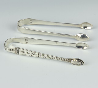 Two pairs of Georgian silver sugar tongs, rubbed marks, 70 grams 