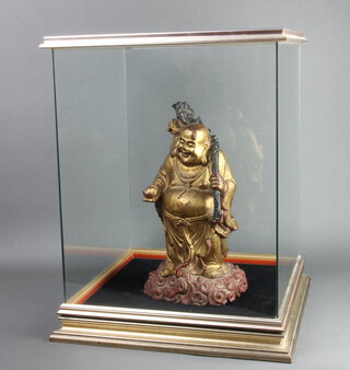 An Eastern carved hardwood figure of Ho Tai, contained in a glazed display cabinet 58cm h x 45cm w x 42cm d