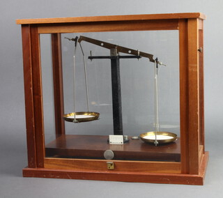 A pair of laboratory scales contained in a mahogany case 40cm x 45cm x 23cm 