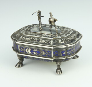 A 19th Century Continental white metal and enamelled Hungarian trinket box raised on hoof feet with later figural finial 9cm, 210 grams 