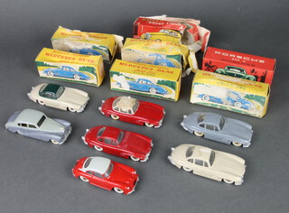 7 french diecast cars by Quiralu, to include 5 Mercedes Benz 300 S.L.s in red / red and cream ( box paper stuck to car )/ cream and green / dark grey / cream, A Porsche 356A in red and cream with a Rolls Royce Silver Cloud in grey / dark grey. All boxed.