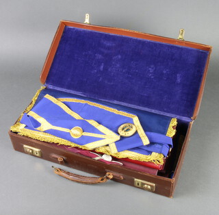 A leather attache case containing a quantity of Masonic regalia comprising Sussex Provincial Senior Grand Wardens full dress apron, collar and jewel, Sussex Provincial Grand Stewards apron and collar, 4 Mark Master Masons aprons, a Royal Ark Mariners apron and a London Grand Rank full dress apron and collar 