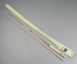 A Farlows Super Parabolic Fario Club 2 piece, split cane, fly fishing rod in maker's green cloth bag