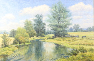 Mervyn Goode, b.1948, oil on canvas signed, a country landscape with cattle beside a stream 70cm x 105cm 