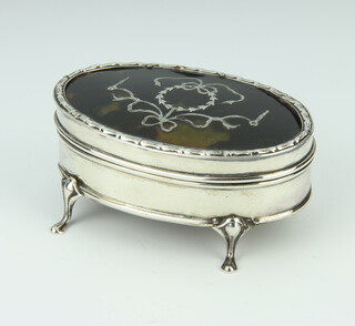 An Edwardian oval silver and tortoiseshell piquet trinket box raised on scroll feet 10cm, Chester 1908 