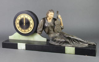 Menneville, a French Art Deco 8 day mantel clock with silvered chapter ring and Arabic numerals, contained in a marble and spelter case supported by a figure of a seated lady with violin 30cm h x 71cm w x 16cm d, the base marked Menneville  