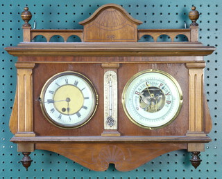 An Edwardian combined timepiece, barometer and thermometer contained in a carved walnut case 38cm h x 50cm w x 12cm d  