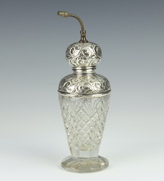 A silver mounted cut glass perfume atomiser with scroll mounts London 1912, 21cm 
