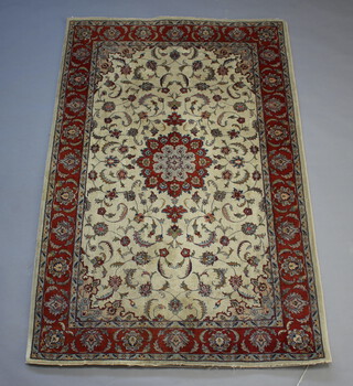 A Northwest Persian white and brown ground floral rug with central medallion within a 3 row border 221cm x 143cm  