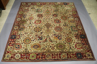A Templeton Abbey cream and brown ground machine made Persian rug 311cm x 270cm 
