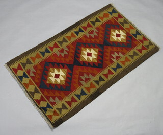 A black, brown and red ground Maimana Kilim with all over geometric designs 139cm x 79cm 