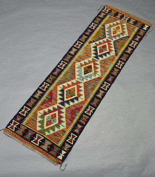 A white, green and turquoise black ground Maimana Kilim runner with all over geometric design 204cm x 61cm 