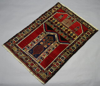 A red and blue ground Belouche prayer rug with temple design to the top 125cm x 85cm 